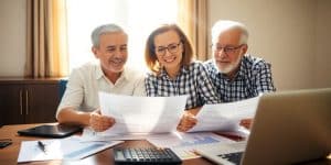 Couple planning finances for retirement at a table.